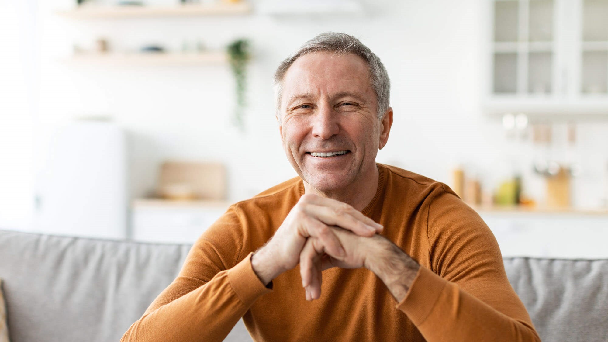 man in orange shirt